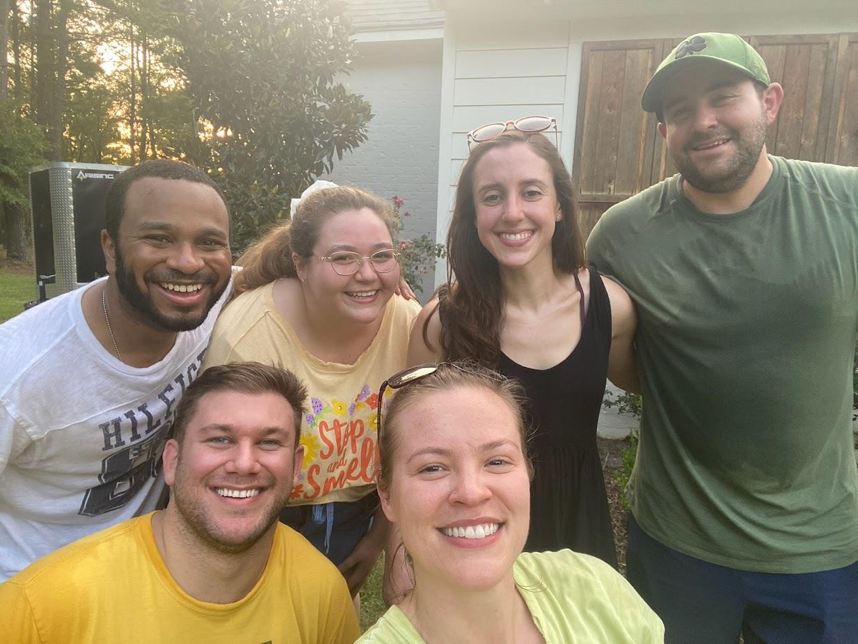 group picture of six pediatric residents at outdoor event